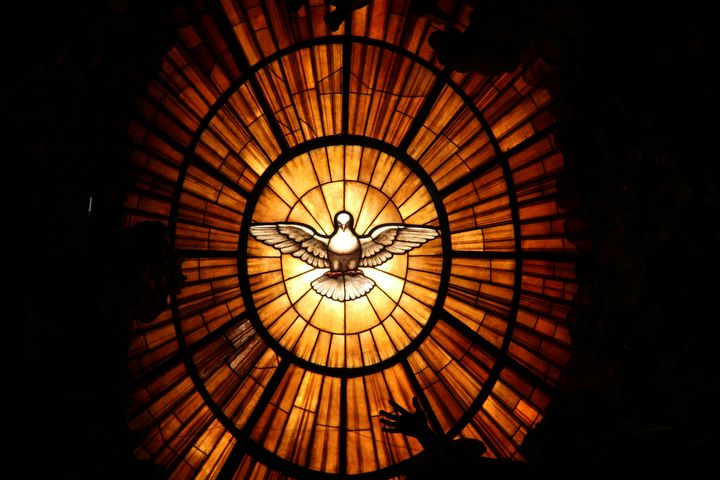 A dove in a church window, symbol of the holy spirit